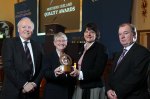 Vice Chair of Triangle Housing Association, Noeleen Diver, receives the organisation's Northern Ireland Quality Award.